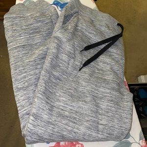 A gray pair of sweat pants. Size large